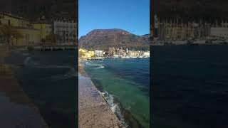 Waves on Salò, Garda lake, whit small rainbow