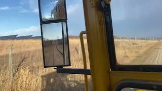 1955 CATERPILLAR MODEL 12 ROLLING SOME GRAVEL