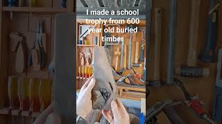 Buried 600 year old timber gets made into the local school trophy.