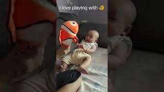 Teasing #baby with a fish doll