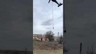 Guard Helo places one-ton sandbag, White Earth, ND April 12, 2023