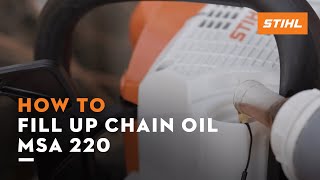 STIHL MSA 220 | How to fill up the chain oil | Instruction