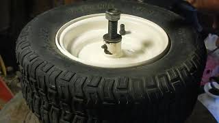 Homemade universal small wheel/lawn tractor/atv tire adapter for tire machines.