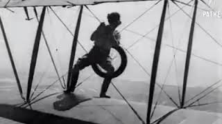 Gladys Ingle changes wheel in mid air