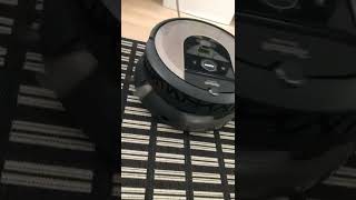 Roomba running on top of a running Navibot