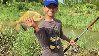 My cousin learns how to fish - Tambaqui pond - Suriname