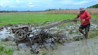 Farmer Operating G1000 Quick Tractor Turning The Dirt Over