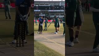 Iftikhar Ahmed and new Zealand player seeing to pitch