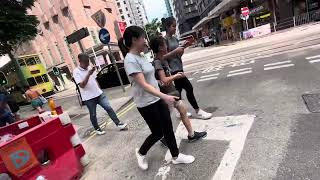 Crossing at the street with lots of plants and flowers!