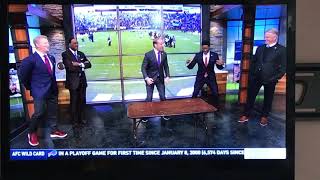 Bill Cowher jumps through table for the Buffalo Bills!