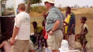 Repairing a Land Rover 88 in Mali With Many Onlookers