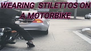 WEARING STILETTOS  ON A MOTORBIKE