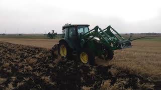 5075M John Deere pulling 4-16 plow