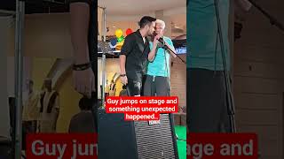 Random guy jumps on stage during performance..