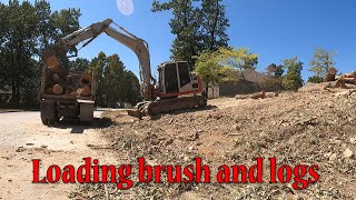 Loading The Brush And Logs On The Clearing Job