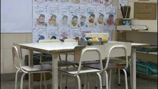 Books or bread: Venezuelan families struggle to afford school supplies