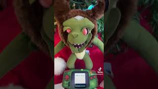 Office Gremlin Opens Christmas Gift