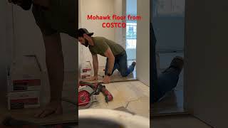 Mohawk flooring from COSTCO. Nice product. Get a tapping block for install.