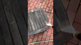 Pressure washer teak wood table.