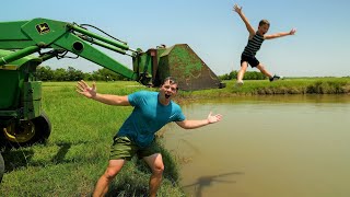 Jumping off tractors into the water and mud | Tractors for kids