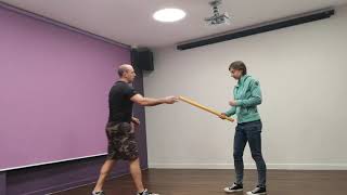 Practicing stick fighting, self defence