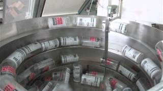 Vibratory bowl feeder for bottles with replenishment belt hopper