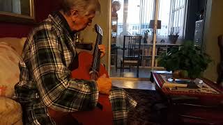 Dad relaxing playing guitar