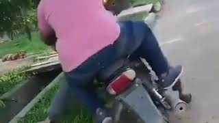 A fat man was ridden on a motorcycle l The motorcycle falled l Sank funny video