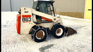 Outfitting the Bobcat 863 with tire chains for snow and ice | Belted Galloway Homestead