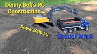 My John Deere 200D LC hydraulic excavator loading my Blue Bruder Tamiya Mack Granite RC Dump Truck