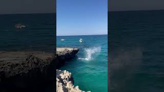 Jumping in the sea near Grotta della Poesia in Puglia - 3 augustus 2022