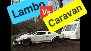 Lamborghini Countach towing. Dude trying to pull a caravan out of ditch.