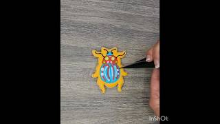 Watch how to create a layered vibrant beetle sugar cookie with royal icing #howto #sugarcookies