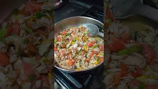 cooking roast breadfruit along with salt fish for dinner