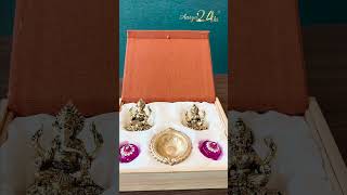 Aarya 24kt presents a beautifully crafted gift hamper featuring a gold-plated Laxmi idol