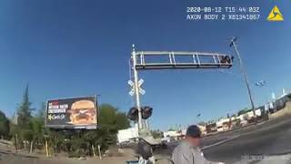 White police office saves man on train tracks in wheel chair