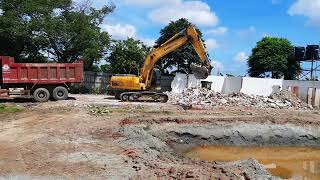 Liugong excavator, loading soil into a dump truck