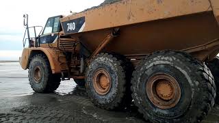 Filling the truck with sand from the sea