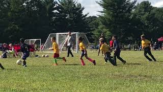 Liam playing soccer