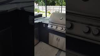 Tile outdoor kitchen w/ cambria countertop.