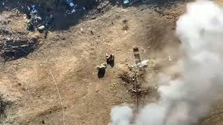 Ukraine - Drone footage of a Ukrainian drone strike and shelling of Russian trenches and soldiers