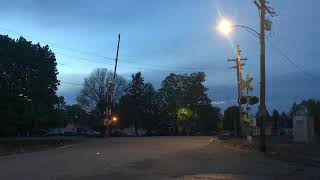 Norfolk and western heritage unit runs slowly through Camden Ohio on a massive train