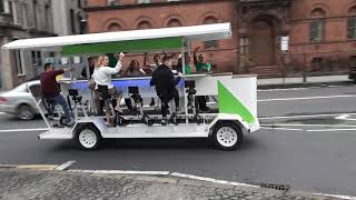 Around the city hall in our party bike in Belfast