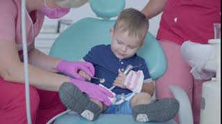 boy in consultation with the dentist