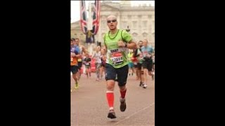 Me finishing the 2019 London Marathon - the guy in green