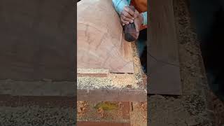 cleaning cover coffin wood with hand saw.