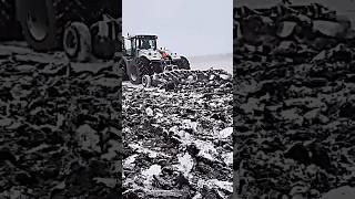 John Deere tractor on snow