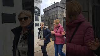 Two Filipinos in Buenos Aires Argentina visiting Evita Peron's tomb.