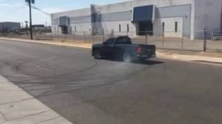 SILVERADO AND RAM DOING DONUTS