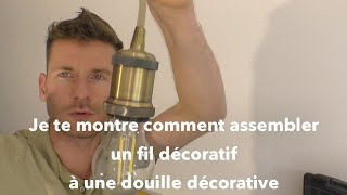 Assemblage d'une douille décorative à un fil décoratif